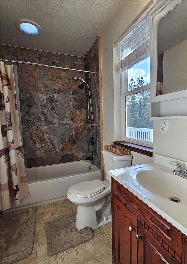 full bathroom featuring vanity, toilet, shower / bathtub combination with curtain, and a textured ceiling