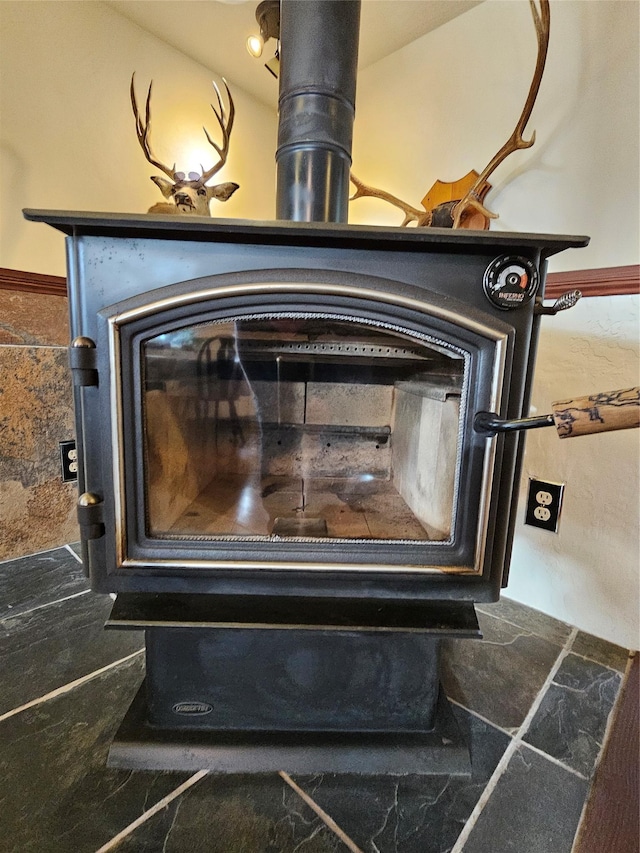 interior details featuring a wood stove