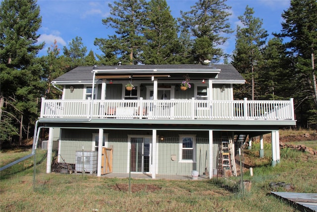 back of property featuring a deck