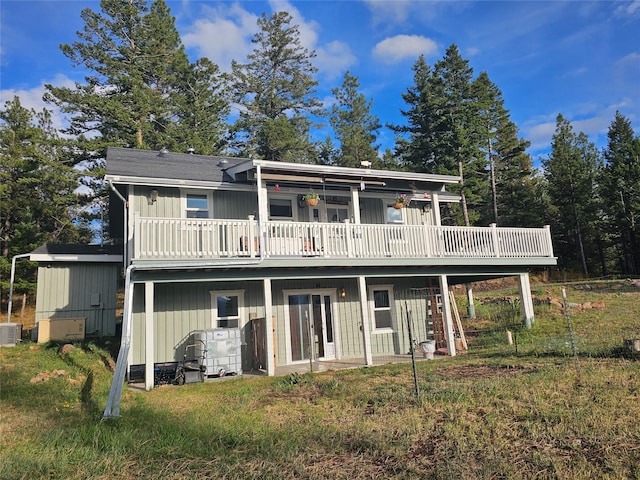 back of property featuring central air condition unit and a wooden deck