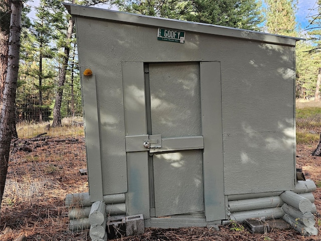 view of storm shelter featuring a storage shed