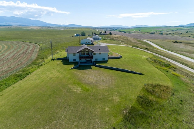 birds eye view of property featuring a mountain view and a rural view