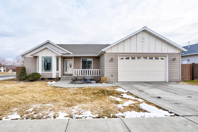 ranch-style house featuring a porch and a garage