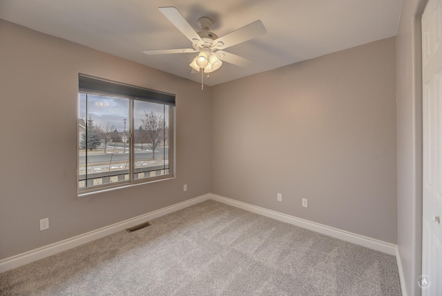 unfurnished room with carpet floors and ceiling fan