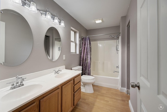 full bathroom with toilet, vanity, wood-type flooring, and shower / bathtub combination with curtain