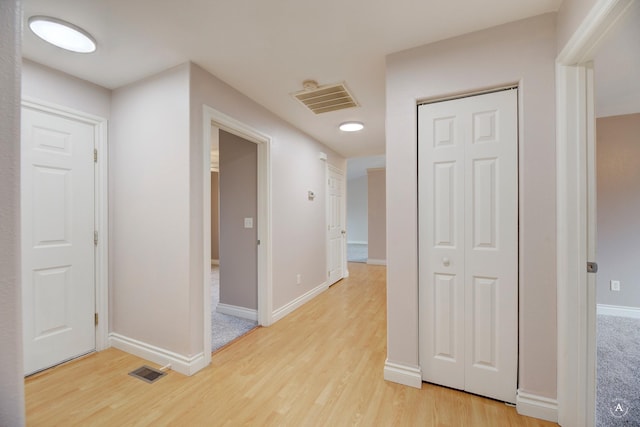 hall with light wood-type flooring