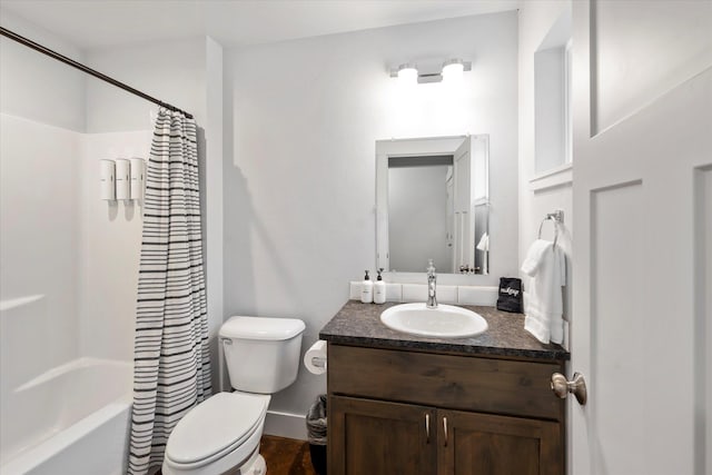 bathroom featuring shower / bathtub combination with curtain, toilet, and vanity