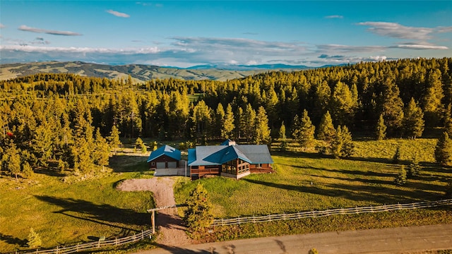805 Georgetown Lake Rd, Anaconda, MT 59711 - aerial view of property and surrounding area featuring a forest and a mountain backdrop