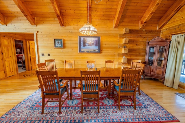 805 Georgetown Lake Rd, Anaconda, MT 59711 - dining space with wooden ceiling, wood walls, light wood-type flooring, and a chandelier