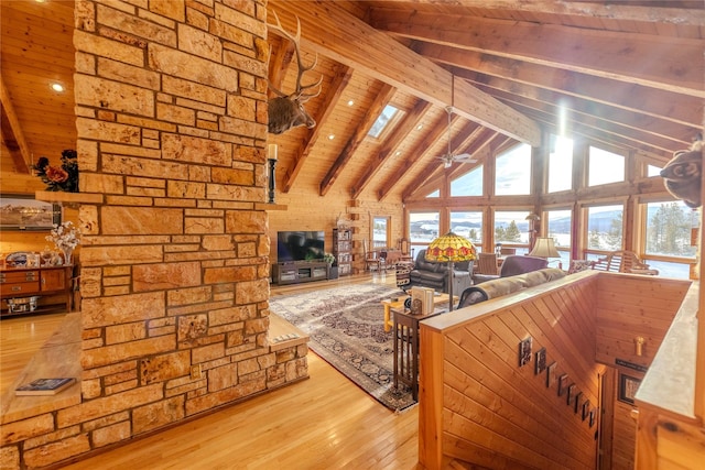 805 Georgetown Lake Rd, Anaconda, MT 59711 - living area with wooden ceiling with exposed beams, hardwood / wood-style flooring, high vaulted ceiling, and ceiling fan