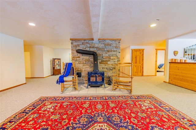 805 Georgetown Lake Rd, Anaconda, MT 59711 - carpeted living area featuring a wood stove, baseboards, recessed lighting, and a textured ceiling