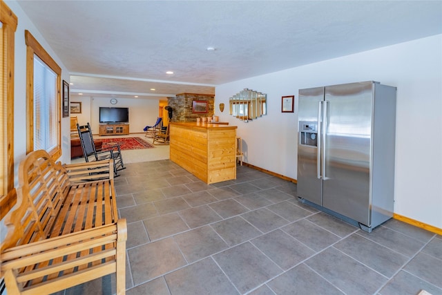 805 Georgetown Lake Rd, Anaconda, MT 59711 - kitchen featuring stainless steel fridge, baseboards, recessed lighting, and dark tile patterned floors