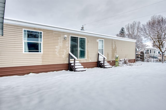 view of snow covered house