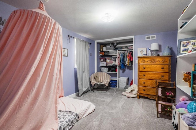 carpeted bedroom with a closet