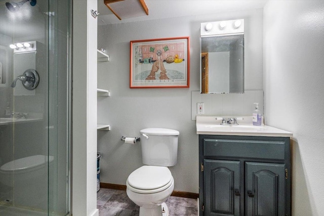 bathroom with a shower, vanity, and toilet