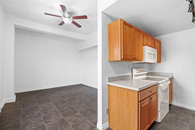 kitchen with white appliances, a textured ceiling, and ceiling fan