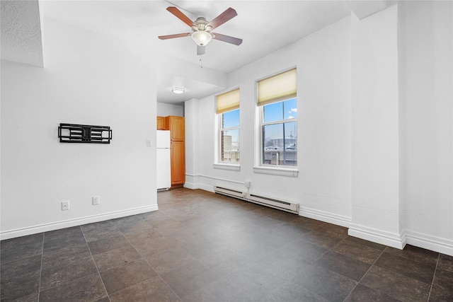 empty room with a baseboard radiator and ceiling fan