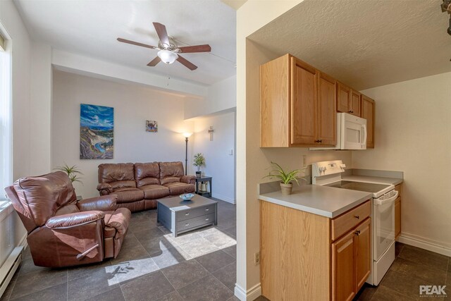 kitchen with a textured ceiling, white appliances, and ceiling fan