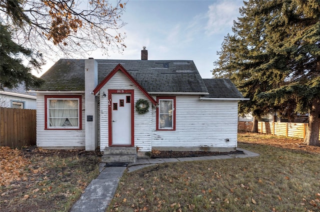 bungalow with a front lawn