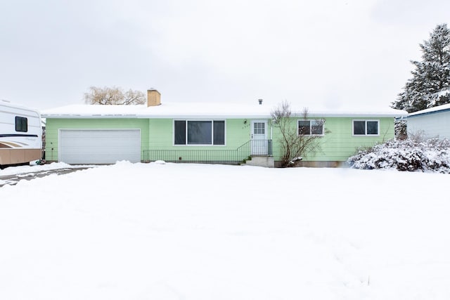 single story home with a garage