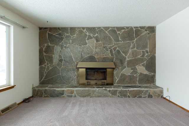 details with carpet, a fireplace, and a textured ceiling