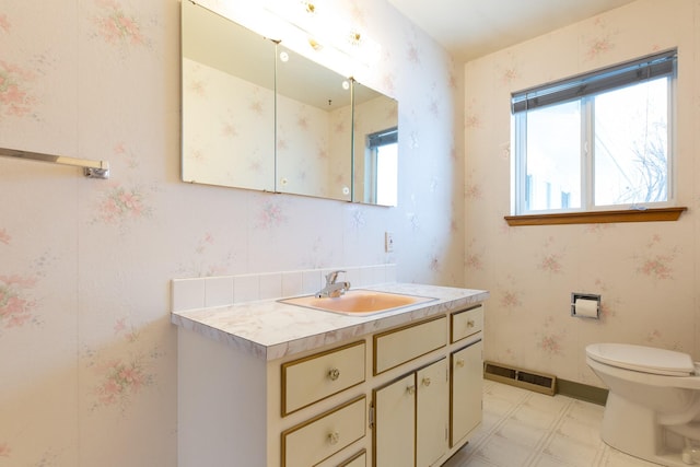 bathroom with vanity and toilet