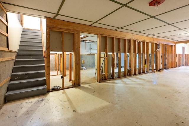 basement featuring a drop ceiling