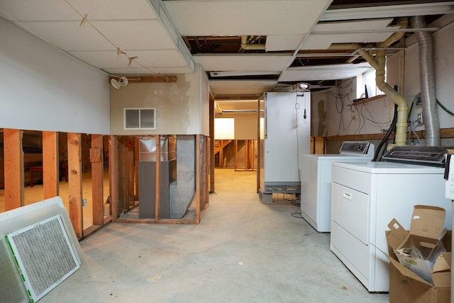 basement featuring washing machine and dryer