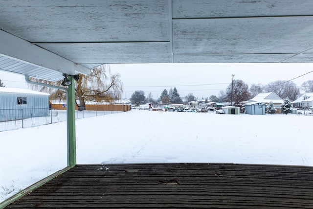 view of yard layered in snow