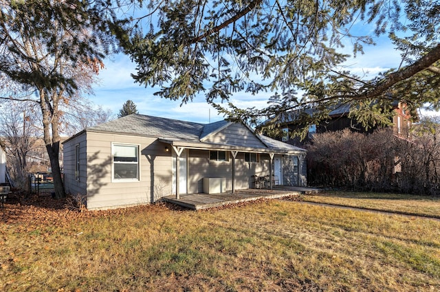 rear view of property with a yard and a patio