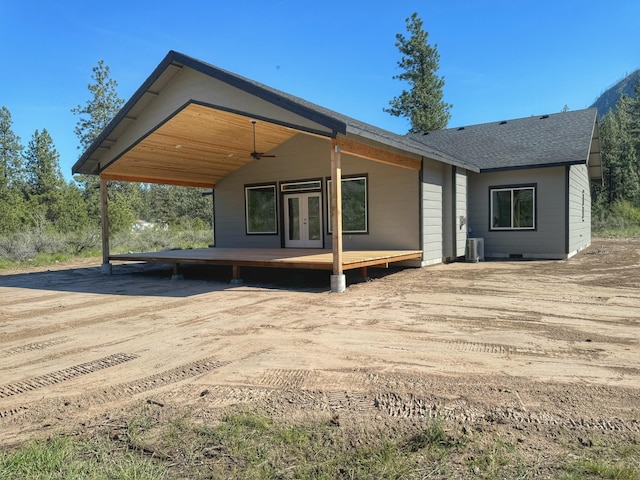 back of house featuring french doors, central AC unit, and a deck