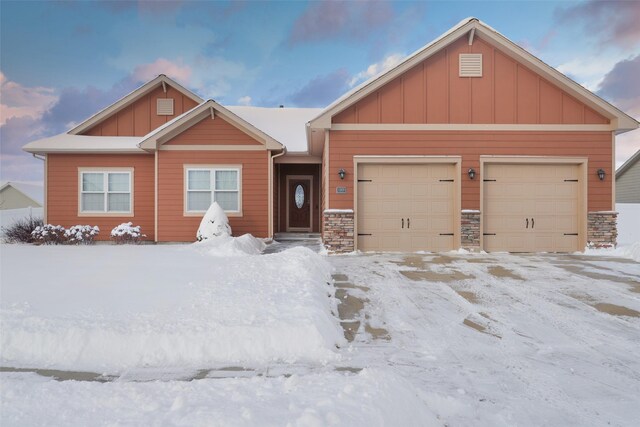 view of snow covered garage