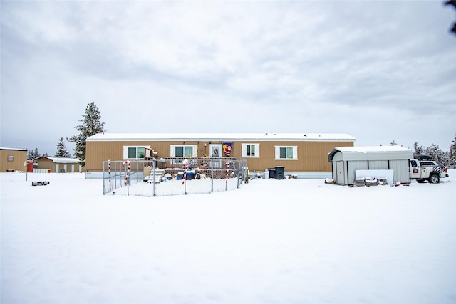 view of snow covered house