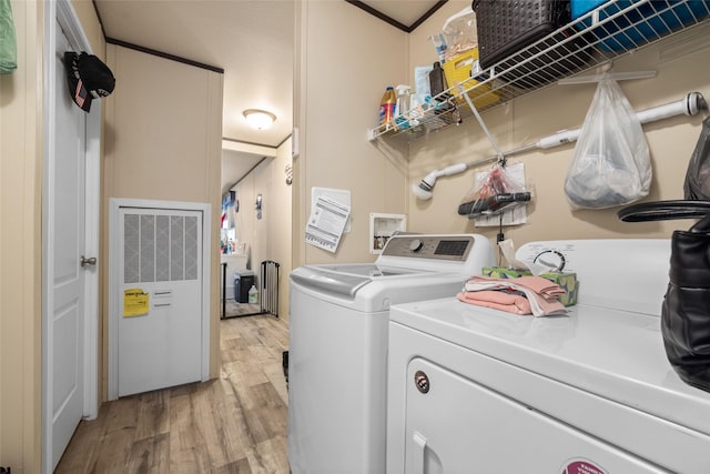 laundry area with light wood-type flooring and independent washer and dryer