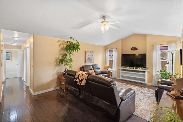 living room with ceiling fan, dark wood-type flooring, and vaulted ceiling