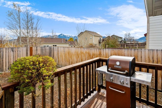 wooden deck with a mountain view