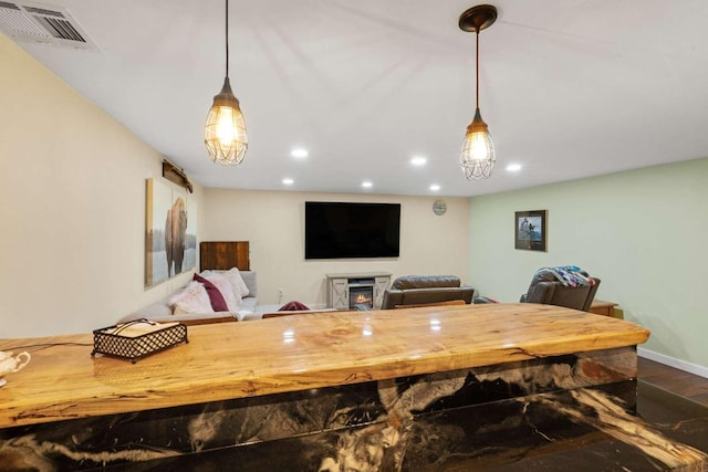 dining space with hardwood / wood-style floors