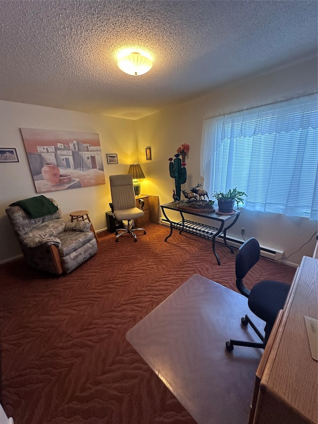 carpeted home office featuring a textured ceiling