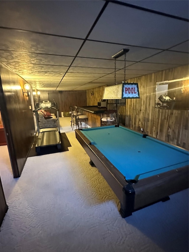 game room with wooden walls and billiards