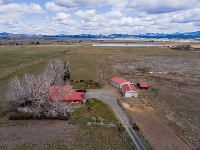 aerial view featuring a rural view and a mountain view