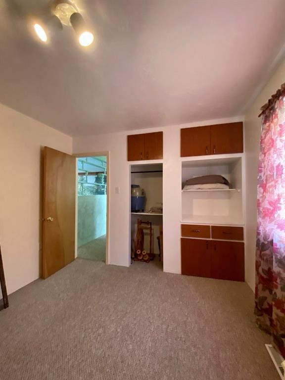 unfurnished bedroom with carpet floors