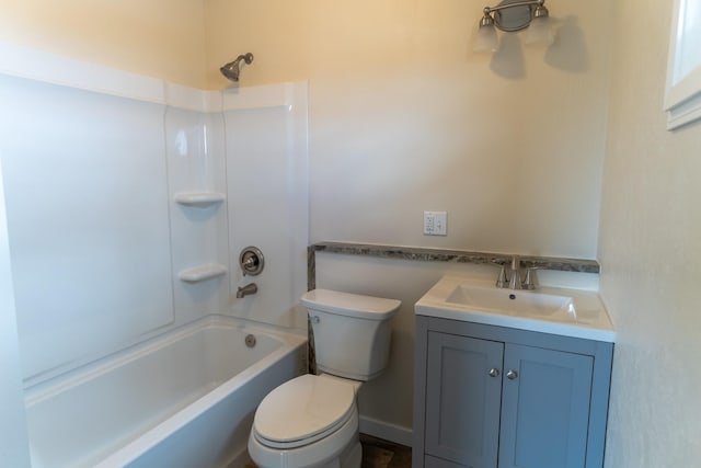 bathroom with toilet, vanity, and  shower combination