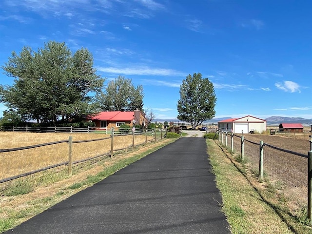 view of street featuring a rural view and driveway