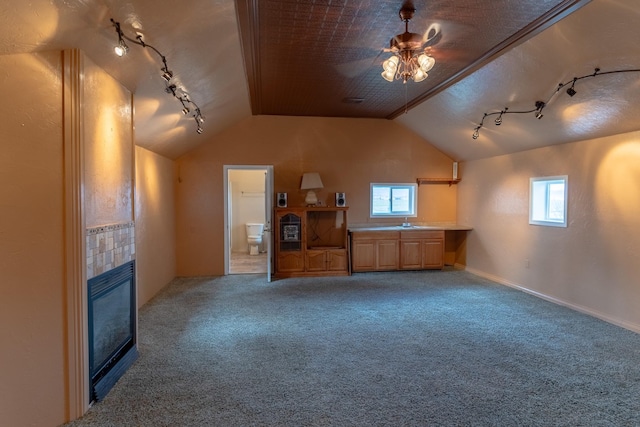 bonus room featuring a ceiling fan, carpet floors, and vaulted ceiling