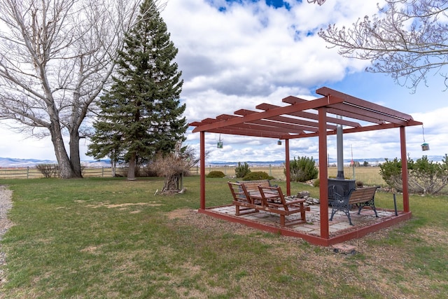 view of yard featuring a pergola and fence