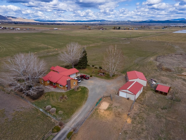 birds eye view of property with a rural view and a mountain view