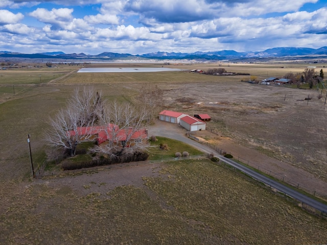 birds eye view of property with a rural view and a mountain view