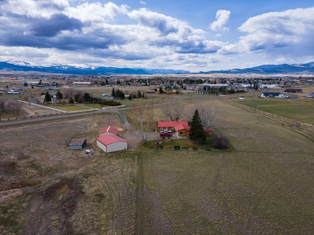 birds eye view of property with a mountain view and a rural view