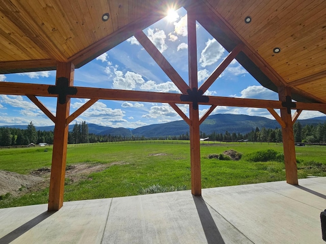 view of patio with a mountain view and a rural view