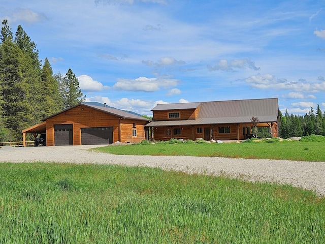 view of front of home featuring a carport and a garage